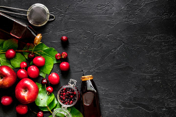 Cranberry morse with apple and pulm on black table top view copyspace
