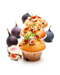 Baked  muffins with figs isolated on white