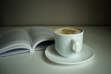 Cup of coffee and book