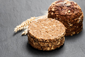Sliced  rye bread on black stone background