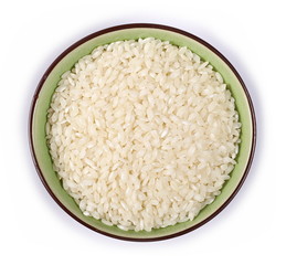 White rice in bowl isolated on white background, top view
