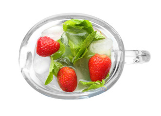 Glass jug with tasty strawberry lemonade on white background