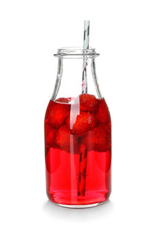 Glass bottle with tasty strawberry lemonade on white background