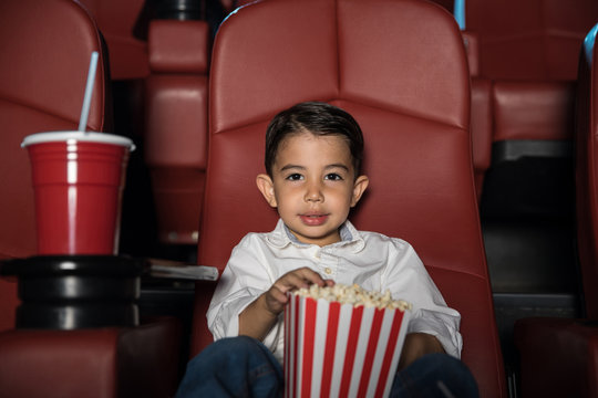 Little boy in a movie theater