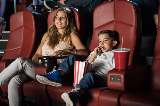 Kid And His Mom In The Movie Theater