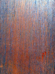 metal sheet with bright orange and blue rust background