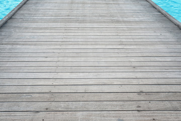 Wooden pontoon on sea beach in summer day