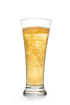 Golden sparkling drink into high glass