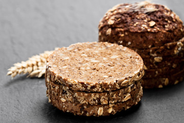 Sliced  rye bread on black stone background