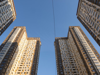Two modern high building view from bottom with blue sky background
