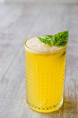 Persian Saffron Milkshake with basil leaves.