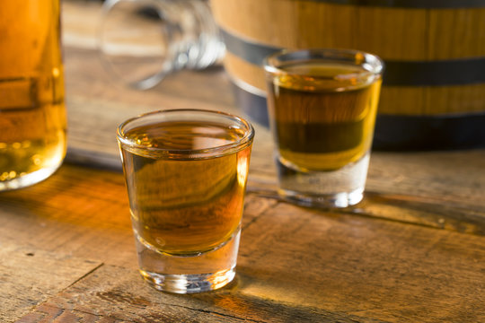 Alcoholic Brown Rum in a Shot Glass