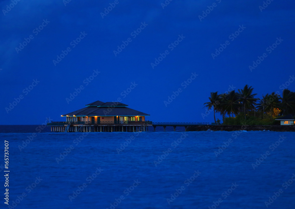 Canvas Prints View of modern beach house at tropical resort in evening