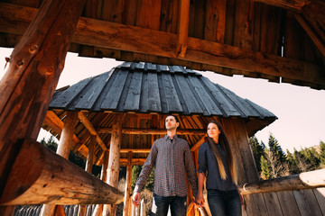 Man walking with his girlfriend in wooden fortress