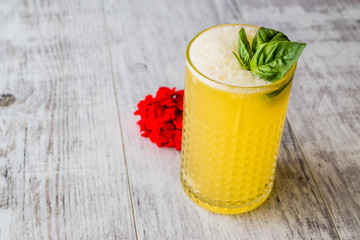 Persian Saffron Milkshake with basil leaves.