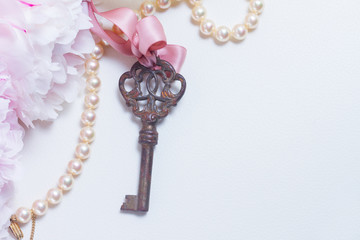 Skeleton vintage key with peony flowers - love and wedding concept