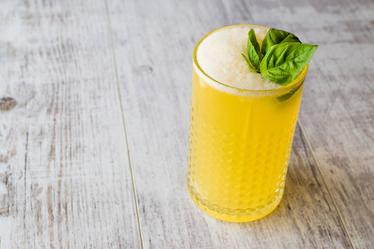 Persian Saffron Milkshake with basil leaves.
