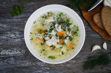 Homemade fish soup on wooden background. Selective focus. Top view