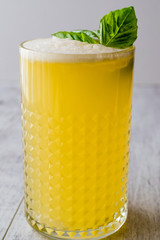 Persian Saffron Milkshake with basil leaves.