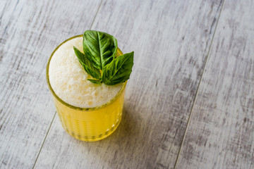 Persian Saffron Milkshake with basil leaves.