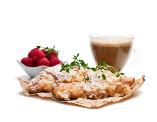 homemade  fresh almond croissant with cup of cappuccino isolated on white