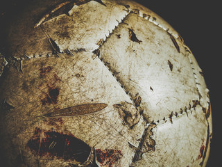 dirty football with traces of blood