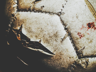 dirty football with traces of blood