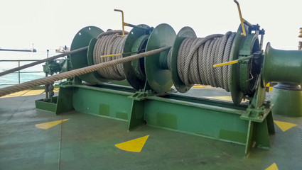 Fototapeta na wymiar Mechanisms of tension control ropes. Winches. Equipment on the deck of a cargo ship or port