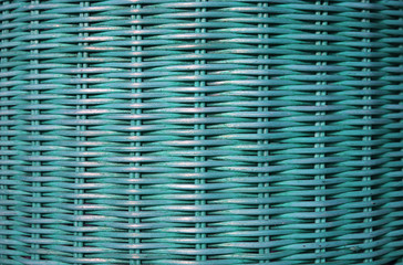 Front view of turquoise blue colored rattan furniture surface, for background and pattern 
