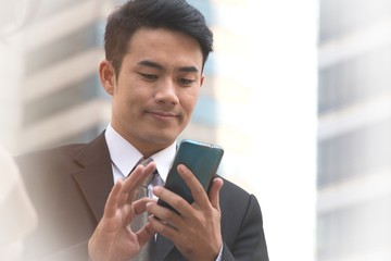 Asian businessman portrait on blurry background