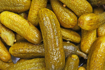 Pickled cucumber closeup texture studio photo.
