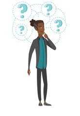 Young african businessman under question marks.