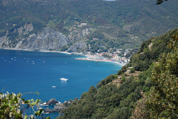 Naklejka premium view of the Cinque Terre's rugged portion of coast on the Italian Riviera with Monterosso al Mare in the distance. Cinque Terre, Italy