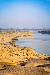 Boat docked in Mekong river near Sam Pan Bok canyon in Ubon Ratchathani , Thailand.