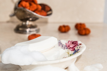 Soap bars in vintage soap dish with floral decor