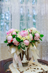 wedding bridal bouquet with white orchids, daisies and red berries