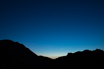 Silhouette of mountains with Twilight sky.