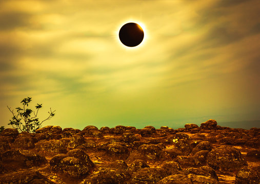 Scientific natural phenomenon. Total solar eclipse with diamond ring effect glowing on sky. glowing on sky.
