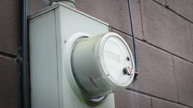 Close up of a generic gas meter on the side of a residential home