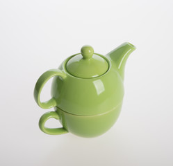 Tea pot set or Porcelain tea pot and cup on background.