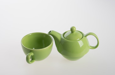 Tea pot set or Porcelain tea pot and cup on background.