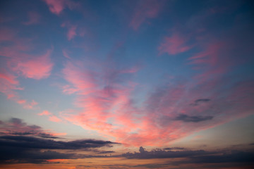 Romantic sunset sunrise sky with dark blue clouds