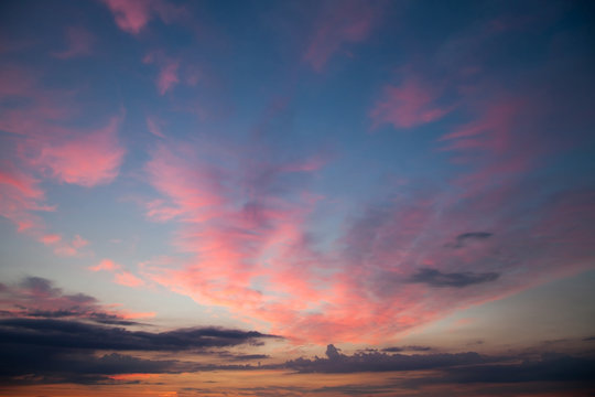 Romantic sunset sunrise sky with dark blue clouds