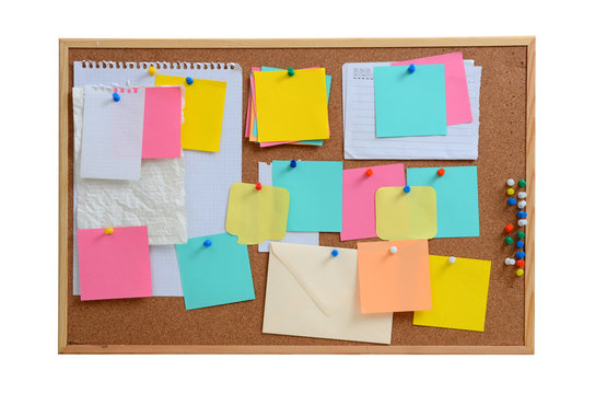 Blank notes pinned into brown corkboard