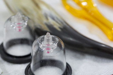Traditional Chinese medical science. Guasha or Scraping, cupping and massage equipment on the table.