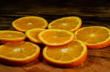 Orange slices on wooden table