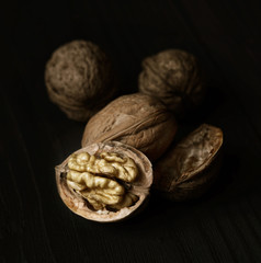 Walnuts on rustic old wooden table