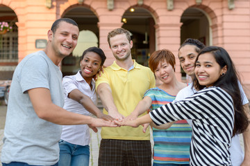 Happy smiling multiracial group of young friends