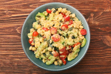 Chickpeas lentils avocado tomato cucumber salad