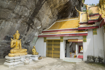 Old golden buddha statue for people visit and praying at Wat Phra Phutthachai in Saraburi, Thailand